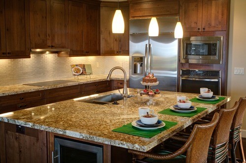 kitchen featuring pendant fixtures and countertop under lighting